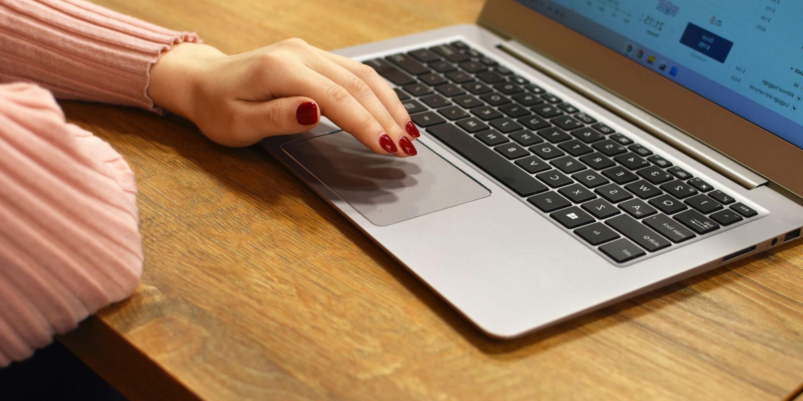 a woman sitting at a laptop